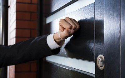A debt collector is knocking on the door